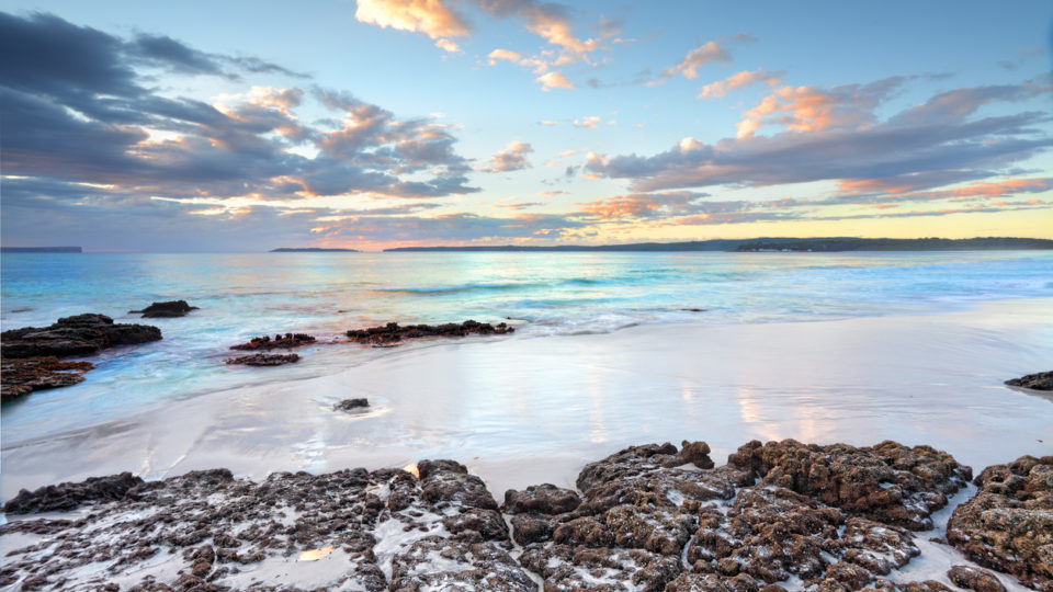 Dawn skies and ocean beach Jervis Bay NSW Australia