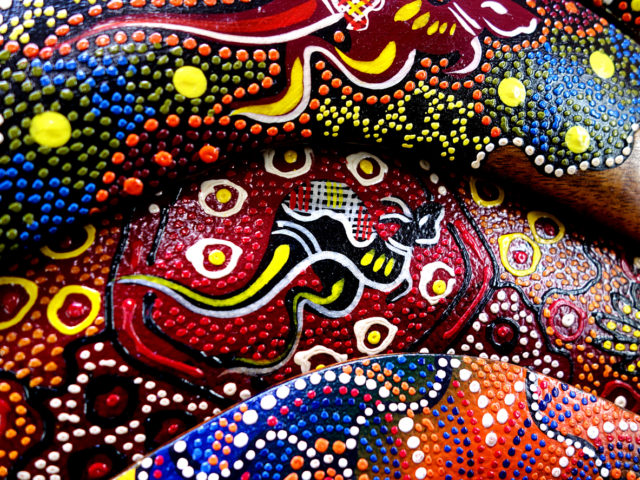 Colourful hand painted boomerang featuring a kangaroo at a market stall in Melbourne Australia