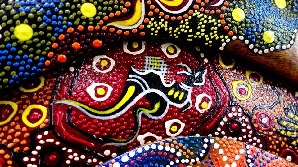Colourful hand painted boomerang featuring a kangaroo at a market stall in Melbourne Australia
